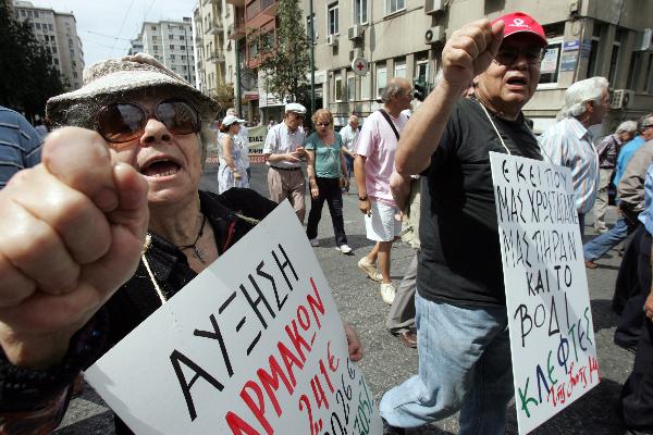 Greek pensioners attend a protest in front of the Health Ministry in Athens, capital of Greece, on June 9, 2010. (Xinhua/Marios Lolos) 
