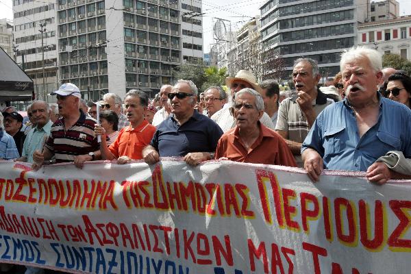 Greek pensioners attend a protest in front of the Health Ministry in Athens, capital of Greece, on June 9, 2010. (Xinhua/Marios Lolos) 