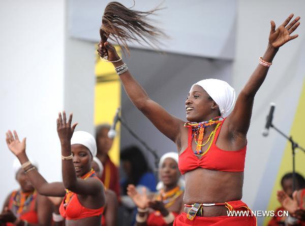 Actresses of a Namibian performance troupe perform folk dance at Africa Square in the World Expo park in Shanghai, east China, on June 9, 2010.