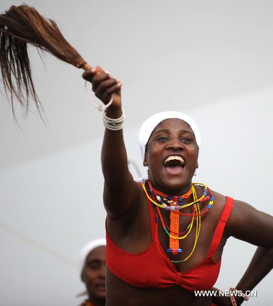 Actresses of a Namibian performance troupe perform folk dance at Africa Square in the World Expo park in Shanghai, east China, on June 9, 2010.