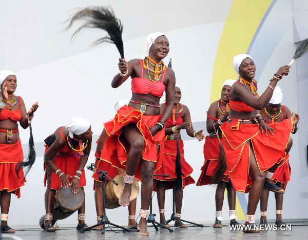 Actresses of a Namibian performance troupe perform folk dance at Africa Square in the World Expo park in Shanghai, east China, on June 9, 2010.