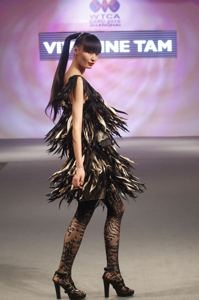 A model presents a creation of fashion designer Vivienne Tam during a fashion show in the World Trade Centers Association (WTCA) Pavillion in the World Expo Park in Shanghai, east China, on June 9, 2010. 