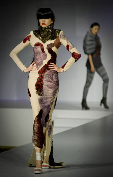 A model presents a creation designed by a graduate of the Institute of Textiles and Clothing during a graduate fashion show in Hong Kong, south China, June 9, 2010.