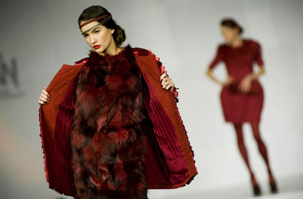 A model presents a creation designed by a graduate of the Institute of Textiles and Clothing during a graduate fashion show in Hong Kong, south China, June 9, 2010.