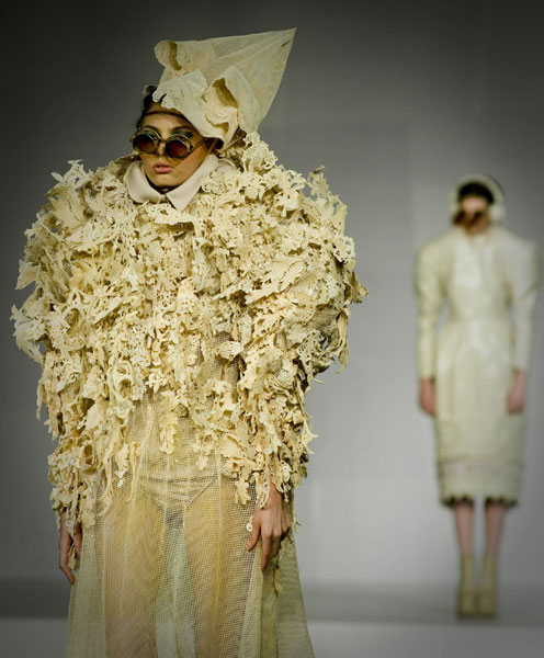 A model presents a creation designed by a graduate of the Institute of Textiles and Clothing during a graduate fashion show in Hong Kong, south China, June 9, 2010. 