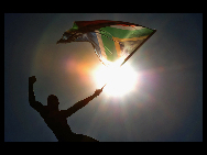 A supporter of South Africa's national soccer team 'Bafana Bafana' celebrates on the streets of Sandton during a parade of their team in Johannesburg June 9, 2010. The 2010 Soccer World Cup kicks off on June 11 at Soccer City stadium with the match between South Africa and Mexico. [gb.cri.cn]