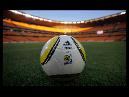 A replica of the Jabulani match ball is seen on the pitch during a test match of youth teams at the Soccer-City stadium in Johannesburg June 8, 2010. [gb.cri.cn]
