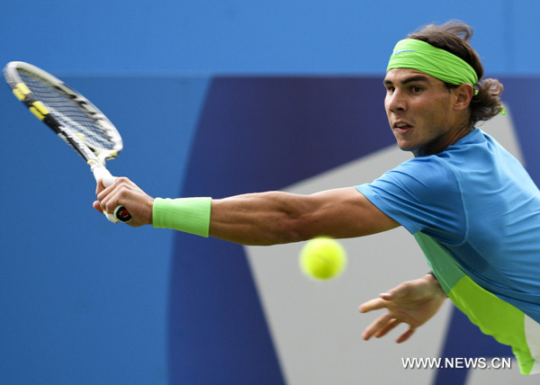 Rafael Nadal of Spain returns the ball during the men's singles second round match against Marcos Daniel of Brazil in 2010's Aegon Championships at the Queen's Club in London, Britain, June 9, 2010. Nadal won 2-0. (Xinhua/Tang Shi)