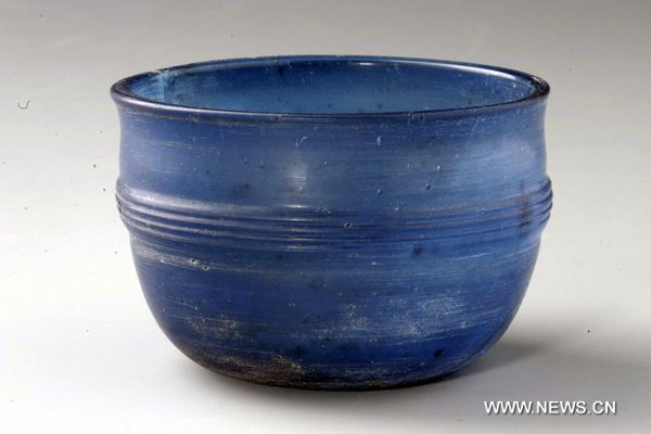 Photo taken on May 7, 2010 shows a color-glazed cup made in ancient China&apos;s Han Dynasty (206 BC-220 AD) and excavated at Caoxie Village in Lianzhou Town of Hepu County, southwest China&apos;s Guangxi Zhuang Autonomous Region.[Xinhua]