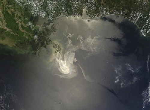 NASA MODIS satellite image, taken May 23, 2010, of the Gulf of Mexico shows the extent of the oil released from the Deepwater Horizon spill. The oil can be seen as a sheen on the water surface. BP was weighing whether to stick with the tricky 'top kill' maneuver or try something else to plug the gushing well that has caused the worst oil spill in U.S. history, its chief operating officer Doug Suttles said on May 29, 2010. [Xinhua/Reuters]