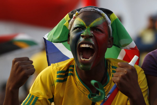 A fan of France waits for a Group A match of the 2010 FIFA World Cup between France and Uruguay at the Green Point stadium in Cape Town, South Africa, on June 11, 2010. (Xinhua/Xing Guangli)