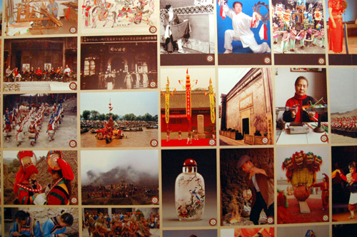 Each photograph has a small brown circle in the bottom right corner, and when visitors touch a special audio device to those circles, they can hear an explanation of the photo. [Courtney Price/China.org.cn]