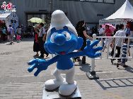 A Smurf standing outside the Belgium / EU Pavilion. Belgium has contributed the world with a handful memorable cartoon figures, including Smurf and Tintin. [Photo by Pierre Chen]