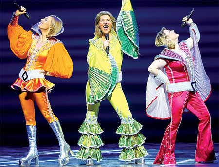 Performers on stage in MAMMA MIA!