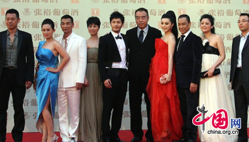 Cast members of the upcoming movie Zhao's Orphan by director Chen Kaige (6th from the left) arrive at Shanghai Grand Theatre for the opening of the 13th Shanghai International Film Festival on June 12, 2010.