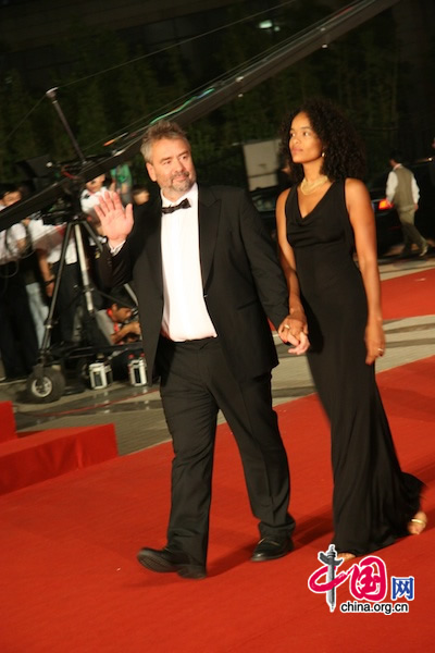 French director Luc Besson and his wife arrive at Shanghai Grand Theatre for the opening of the 13th Shanghai International Film Festival on June 12, 2010.