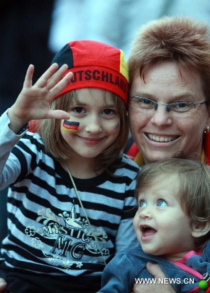 Fans cheer for the German team as they watch 2010 FIFA World Cup Group D first round match between Germany and Australia, in Saarbruecken, capital of western Germany&apos;s Saarland state, on June 13, 2010. Germany won the match 4-0 in Durban, South Africa, June 13. (Xinhua/Luo Huanhuan)