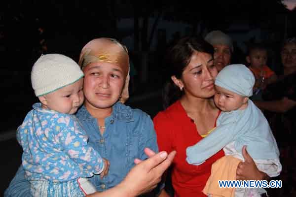 Kyrgyz refugees are seen in Andizhan, the Uzbek border region with Kyrgyzstan, June 14, 2010.