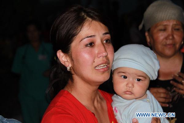 Kyrgyz refugees are seen in Andizhan, the Uzbek border region with Kyrgyzstan, June 14, 2010. [Xinhua]