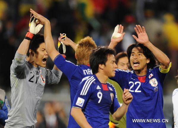 Japan's players celebrate after winning their Group E first round 2010 World Cup football match against Cameroon at Free State stadium in Bloemfontein, South Africa, on June 14, 2010.