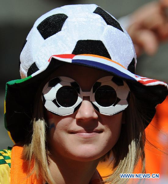 A girl from Netherlands wears a soccer-shaped hat and glasses waiting for the start of the Group E first round 2010 World Cup football match between Netherlands and Denmark at Soccer City stadium in Johannesburg, South Africa, on June 14, 2010.