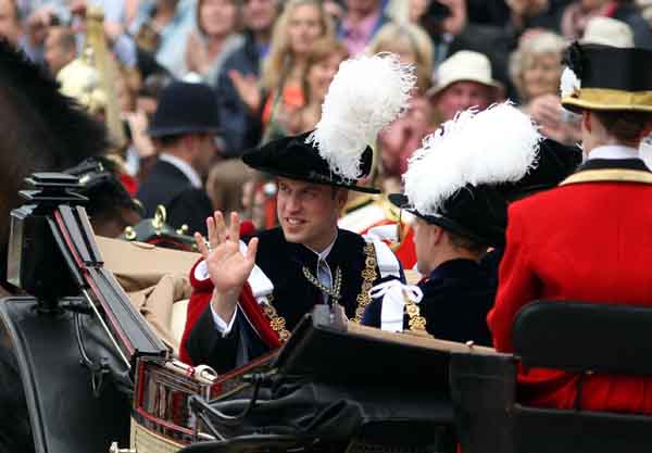 Britain's Prince William leaves after the procession of the Order of the Garter in Windsor, London June 14, 2010. The order was founded by King Edward III in 1348 and includes the Prince of Wales and 24 knights.