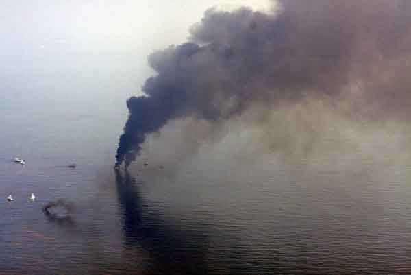 Smoke rises from a controlled burn of oil from the Deepwater Horizon wellhead on the water off the coast of Louisiana June 13, 2010 in the Gulf of Mexico. President Barack Obama and top BP executives are set for a showdown over the Gulf of Mexico oil spill this week, as the likely damages bill piles more pressure on the oil giant's shares. Photo taken June 13, 2010.