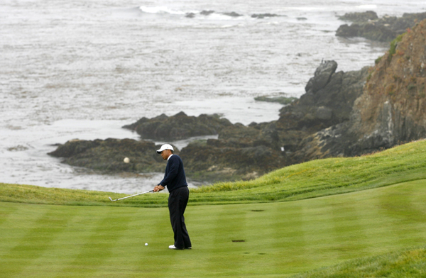 Tiger Woods of the US chips to the eighth hole during a practice round for the U.S. Open Golf Championship in Pebble Beach, California, June 14, 2010.