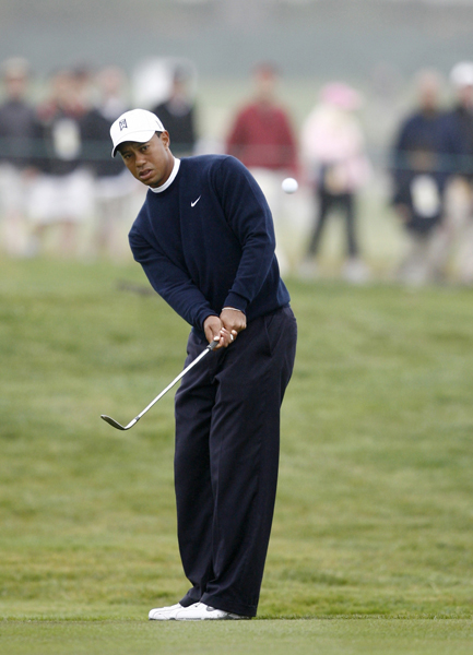 Tiger Woods of the U.S. watches his chip shot on the sixth hole during a practice round for the U.S. Open Golf Championship in Pebble Beach, California, June 14, 2010.