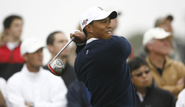 Tiger Woods of the U.S. watches his tee shot on the ninth hole during a practice round for the U.S. Open Golf Championship in Pebble Beach, California, June 14, 2010.