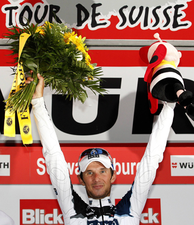 Saxo Bank rider Franck Schleck of Luxembourg celebrates on the podium after he won the third stage of the Tour de Suisse from Sierre to Schwarzenburg June 14, 2010.