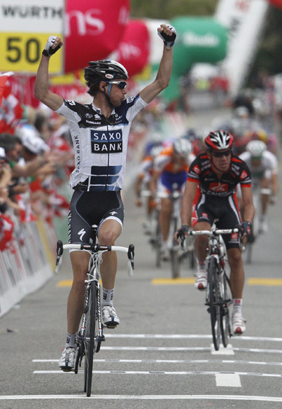 Saxo Bank rider Franck Schleck of Luxembourg reacts as he crosses the finish line to win the third stage of the Tour de Suisse from Sierre to Schwarzenburg June 14, 2010.