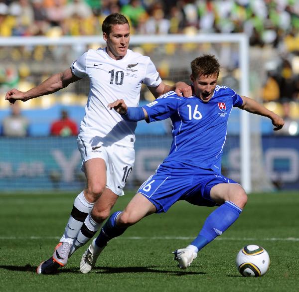 New Zealand's Chris Killen (L) vies with Slovakia's Jan Durica during the Group F first round 2010 World Cup football match in Rustenburg, South Africa, on June 15, 2010. (Xinhua/Wang Yuguo)