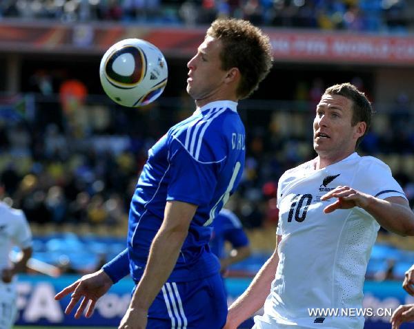 Chris Killen(R) of New Zealand fights for the ball with Slovakia's Jan Durica during their Group F first round match at 2010 FIFA World Cup at Royal Bafokeng stadium in Rustenburg, South Africa, on June 15, 2010.(Xinhua/Xu Suhui)