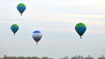 Hot air balloons fly over Qiongzhou Strait