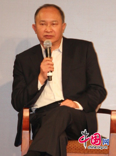 Hong Kong director John Woo, jury president of the 13th Shanghai International Film Festival, speaks at a forum held at Shanghai Film Art Center on June 17, 2010.