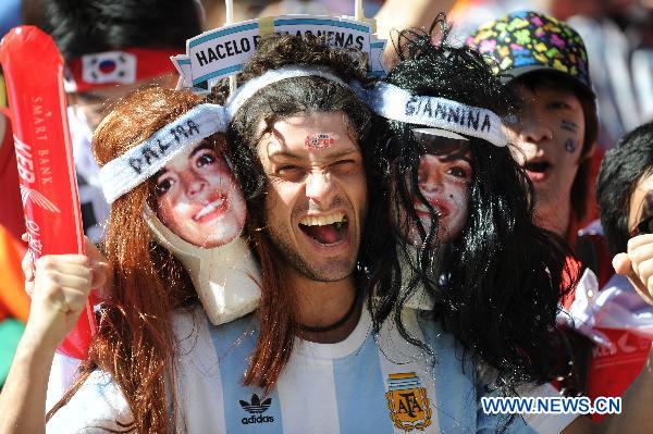 An Argentine supporter cheers prior to a 2010 World Cup Group B match between Argentina and South Korea at the Soccer City stadium in Soweto, suburban Johannesburg, South Africa, on June 17, 2010.[Xinhua/Guo Yong]