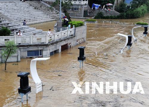 Some areas along the river in Liuzhou City, Guangxi Zhuang Autonomous Region, are flooded on June 18, 2010.