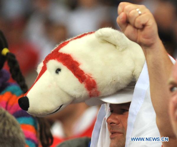 A fan with a polar bear hat waits for the start of the 2010 World Cup Group C match between England and Algeria in Cape Town, South Africa, June 18, 2010. 