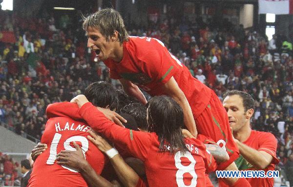 Players of Portugal celebrate a goal during their 2010 World Cup group G soccer match against Democratic People's Republic of Korea (DPRK) at Green Point stadium in Cape Town, South Africa, June 21, 2010. (Xinhua/Xing Guangli)