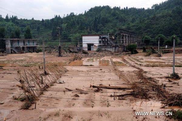 Farmlands are destroyed by flood at Taining County, southeast China&apos;s Fujian Province, June 19, 2010.