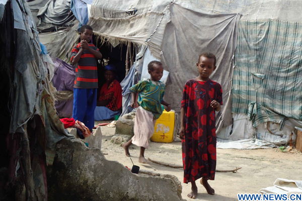 Children play at a refugee camp in the Somali capital Mogadishu June 20, 2010. (Xinhua/Ismail Warsameh)