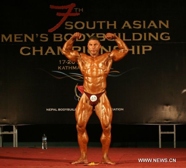 Parwiz Shukram of Afghanistan competes during the Light Heavy Weight (90Kg) category at the 7th South Asian Men&apos;s Bodybuilding Championship in Kathmandu, capital of Nepal, June 19, 2010. [Xinhua]