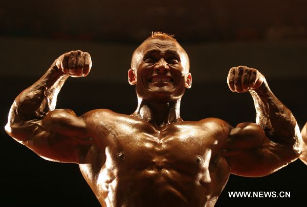 Aram Bam Booy Singh of India, gold medalist of the Welter Weight (75Kg) category, competes at the 7th South Asian Men&apos;s Bodybuilding Championship in Kathmandu, capital of Nepal, June 19, 2010.[Xinhua]