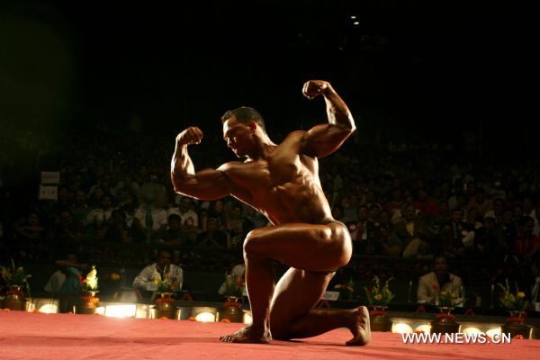 Kiran Shrestha of Nepal, competes during the Welter Weight (75Kg) category at the 7th South Asian Men&apos;s Bodybuilding Championship in Kathmandu, capital of Nepal, June 19, 2010. [Xinhua] 