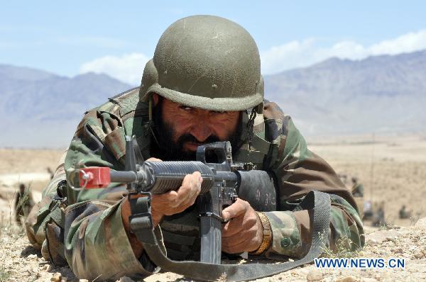 A soldier of Afghanistan army trains at a training station in Kabul, capital of Afghanistan, June 14, 2010. NATO-led International Security Assistance Force (ISAF) is scheduled to launch a large scale military operation in south Afghan Kandahar Province. [Sarosh/Xinhua]