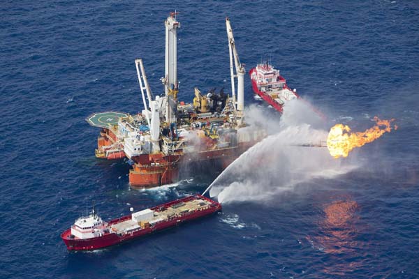  The Q4000 multi-purpose oil field intervention vessel burns off material from the Deepwater Horizon wellhead near the disaster site in this June 22, 2010 handout photo.[Xinhua/Reuters] 