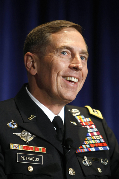 U.S. Army General David Petraeus, commander of U.S. Central Command, smiles while speaking at the Association of the United States Army (AUSA) annual meeting in Washington October 6, 2009. [Xinhua]