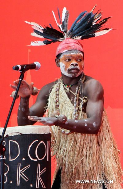 An actor performs during activities marking the National Pavilion Day of Democratic Republic of Congo in the World Expo Park in Shanghai, east China, on June 23, 2010. The National Pavilion Day of Democratic Republic of Congo is celebrated on Wednesday. 
