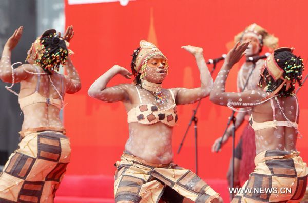 Performers dance during activities marking the National Pavilion Day of the Democratic Republic of the Congo in the World Expo Park in Shanghai, east China, on June 23, 2010. The National Pavilion Day of the Democratic Republic of the Congo is celebrated on Wednesday. 